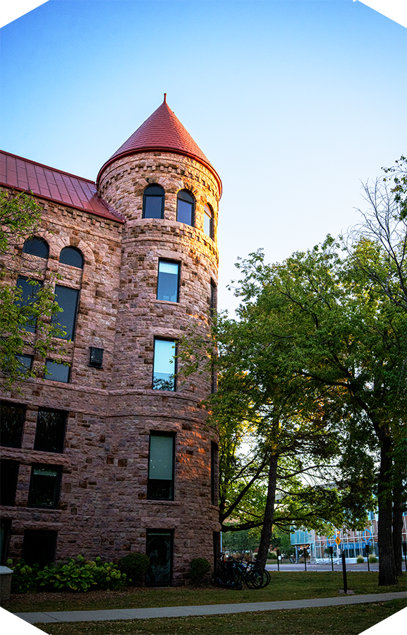 Historic East Hall at DSU: a brick building with a curved tower.