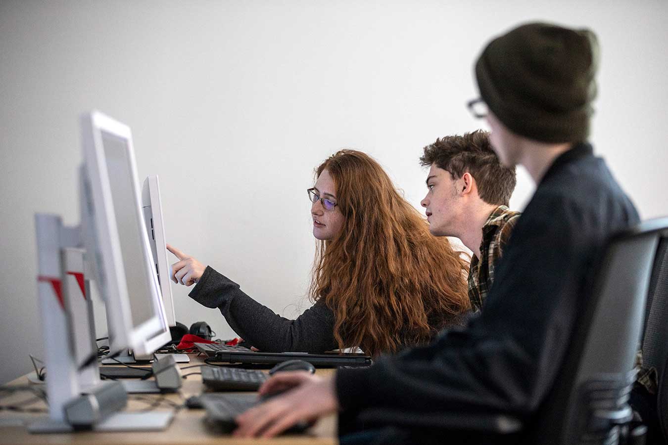 students in class looking at computer screen