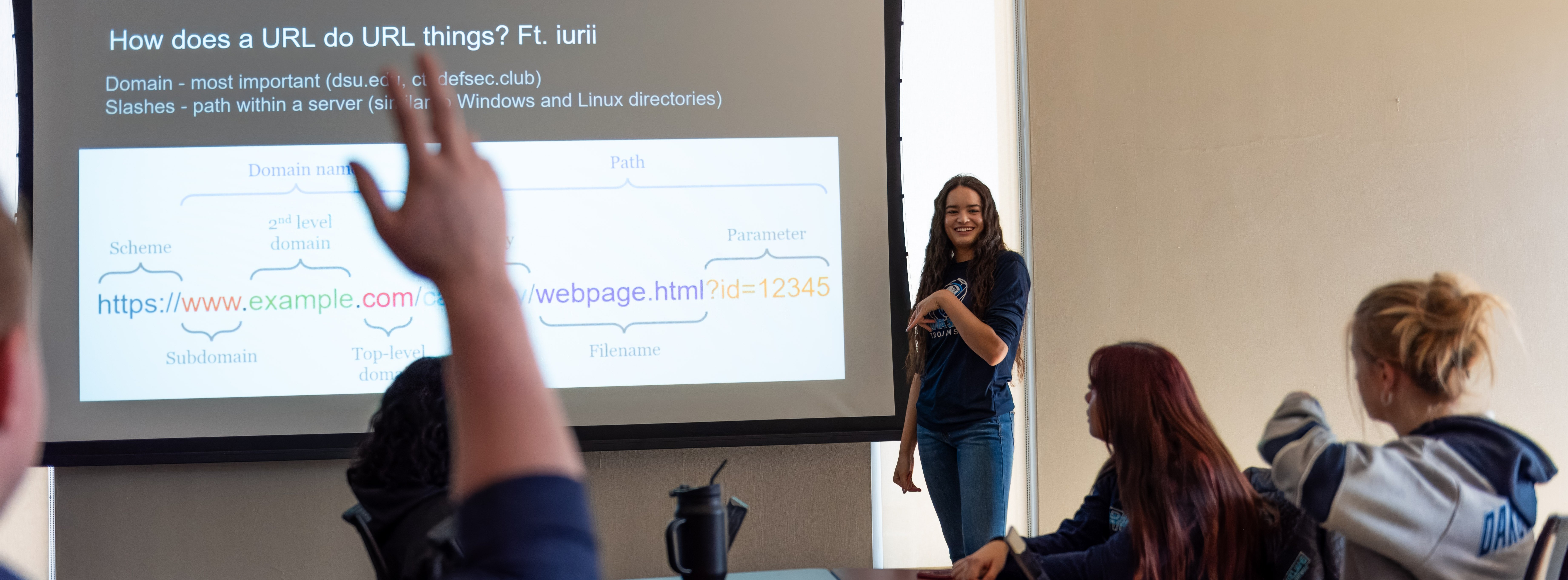 Student presenting in front of class