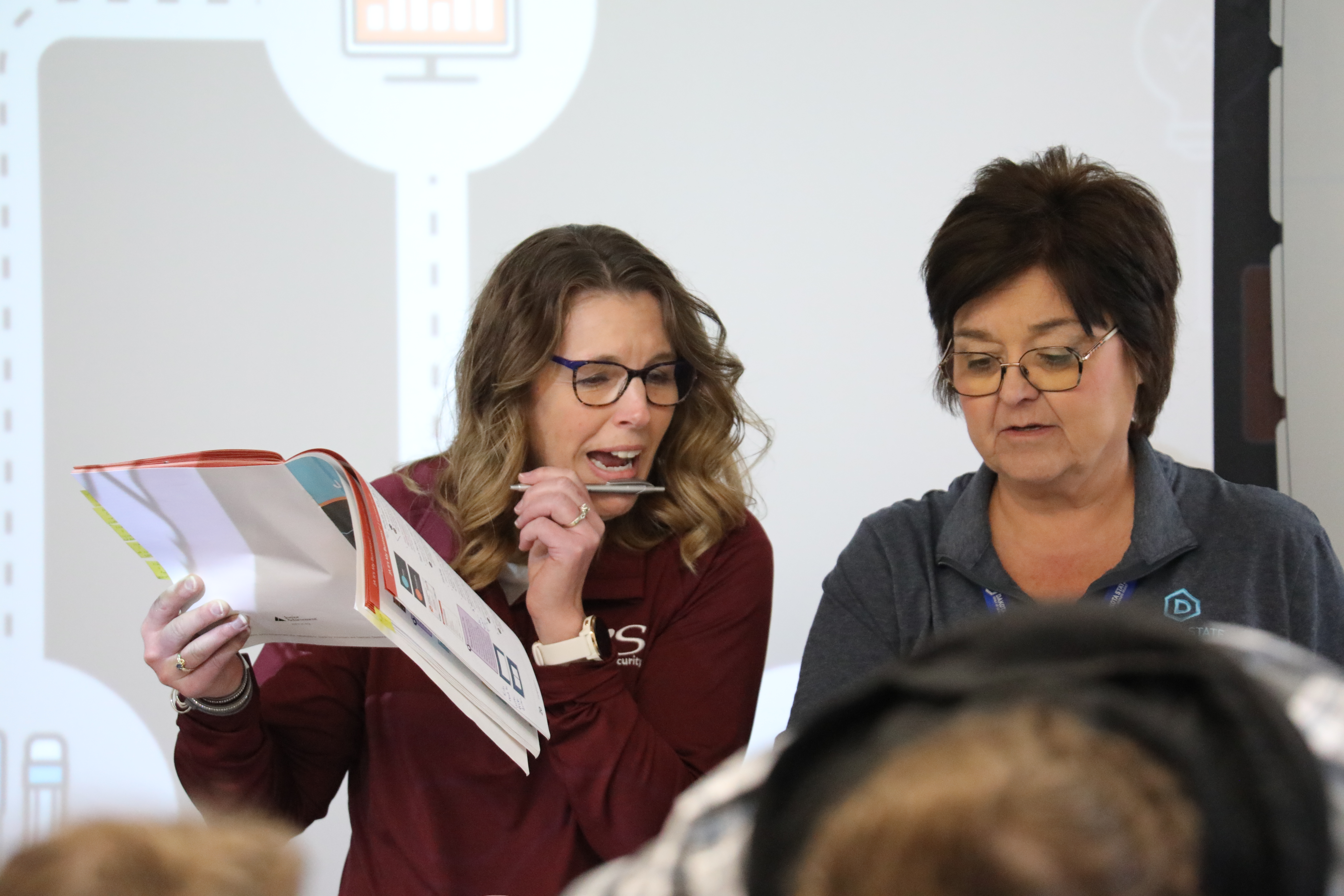 Two female professors teaching class