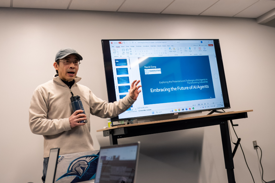 beacom professor lecturing in class about AI agents