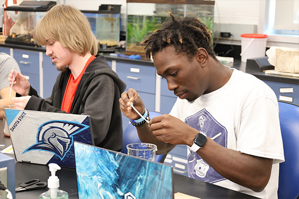 student using a pipette