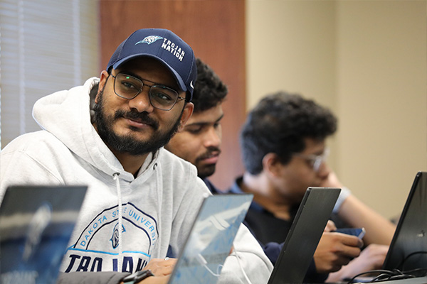 Computer information system student attending class.