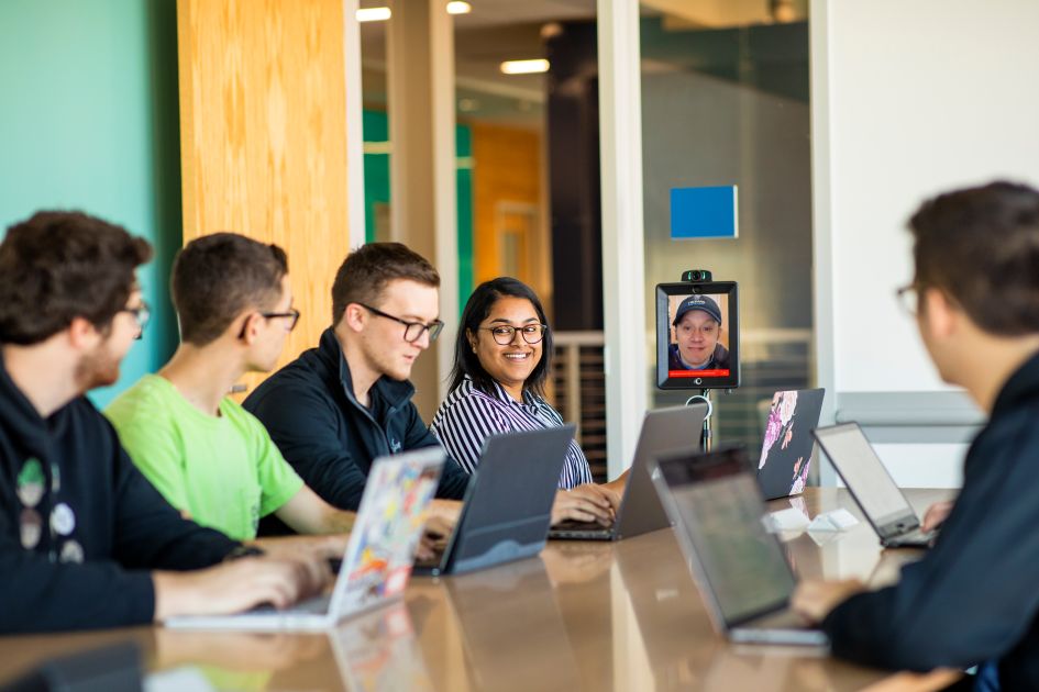 Students attending a meeting in a conference room