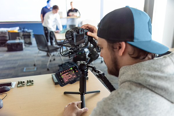 Digital photography student working with a rig mounted camera.