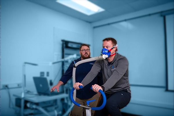 Exercise Science students with breath mask on an exercise machine