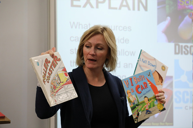 teacher holding books