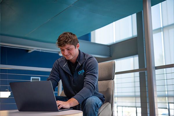 student working at laptop