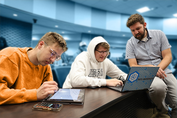 highi-performance research computing students consulting with professor in class