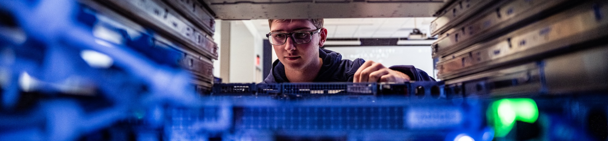 student working in beacom server room