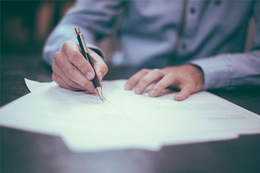 Student filling out paperwork.