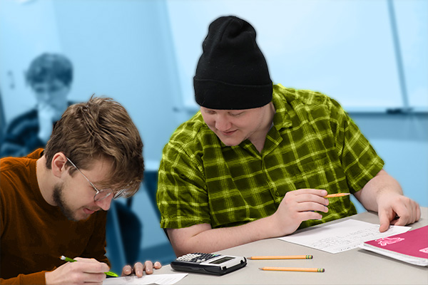 Applied math students in class looking at a calculator