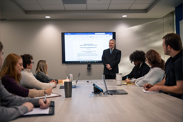 students in a meeting room