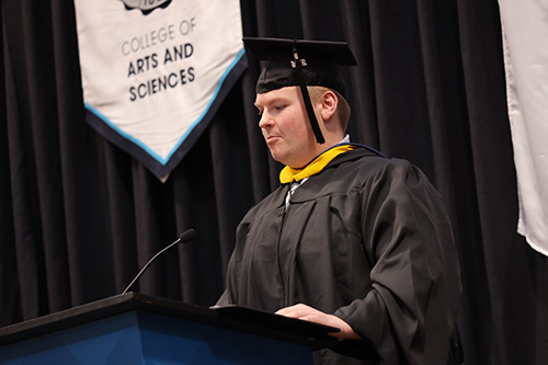 Zach Rohrbach speaking at graduation