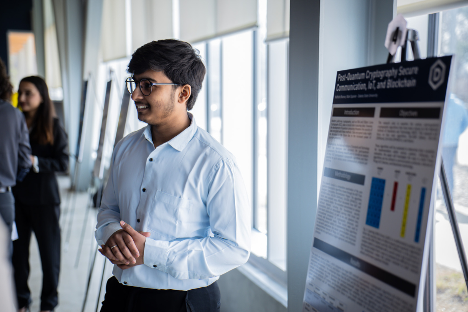 Student showcasing their work at the Research Symposium