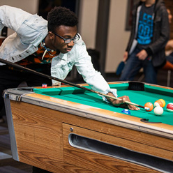 students playing pool