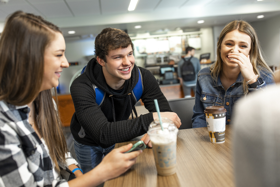 Students with coffee at a table