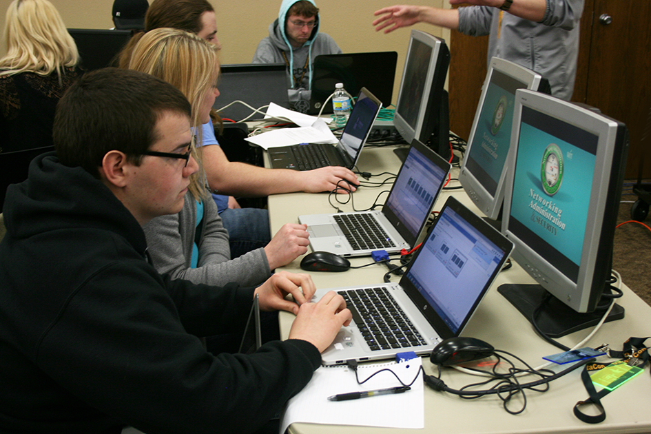 group of students looking at computers