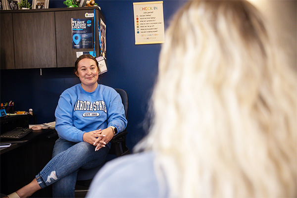 DSU certified counselor talking with a student