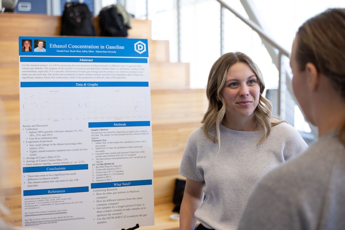 student presenting at research week