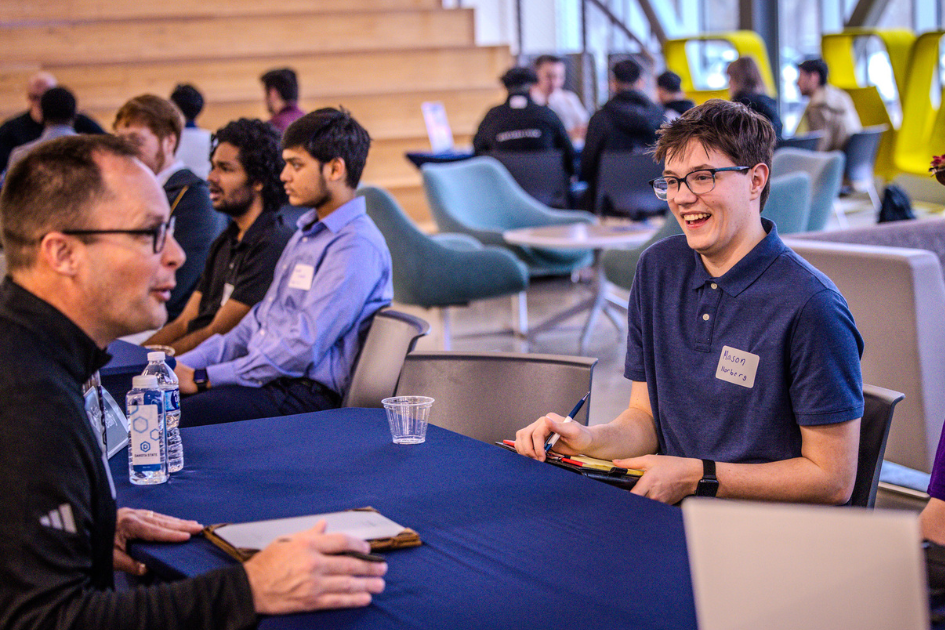 dsu student talking to employer at speed networking event
